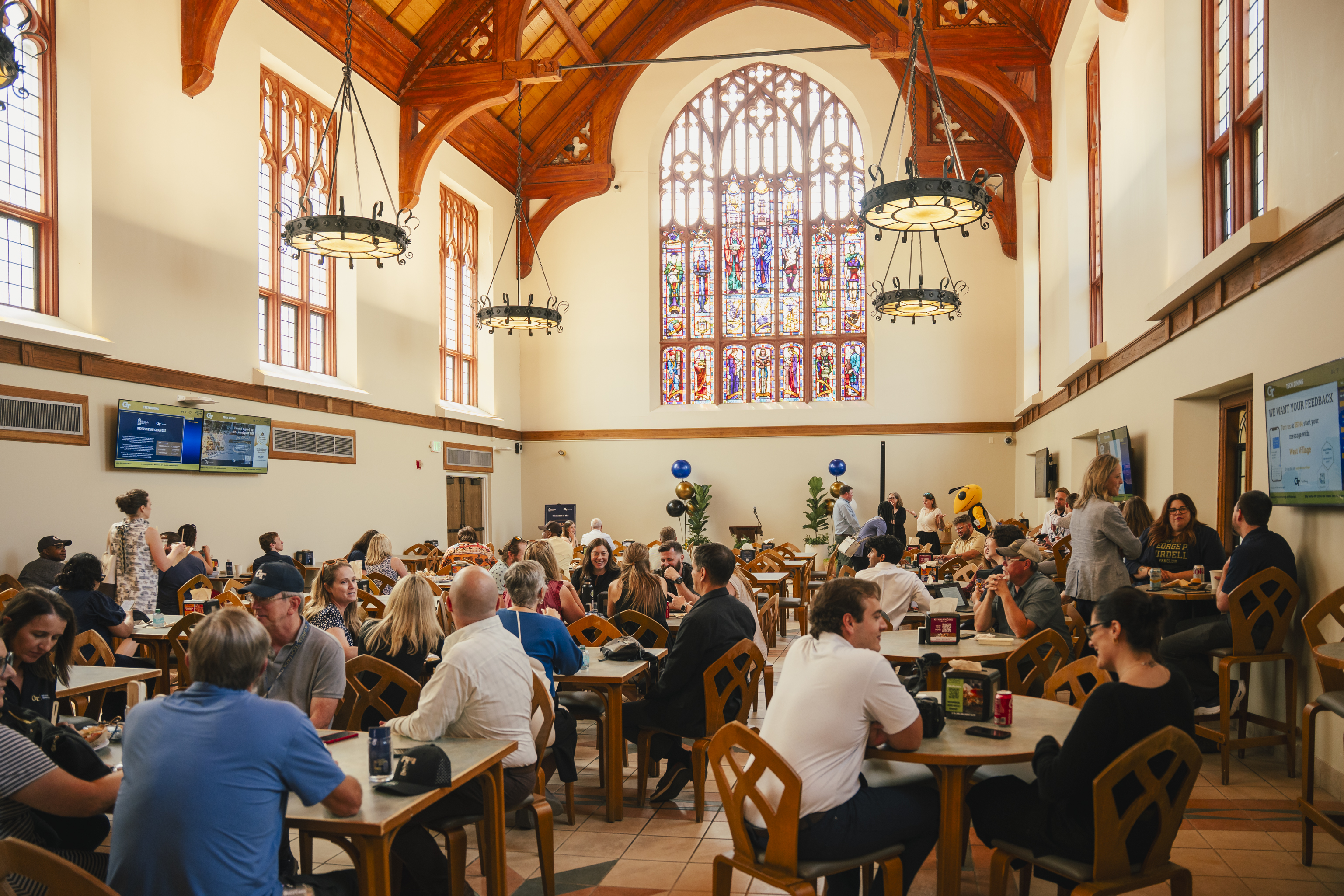 group of staff members seated at Brittain Dining Hall